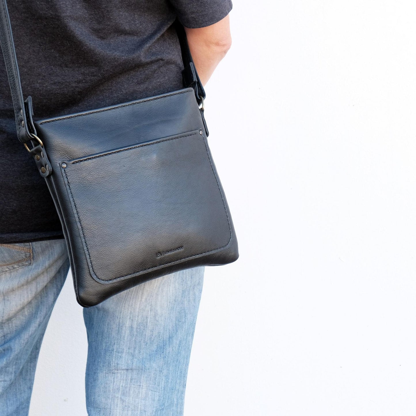 Cross over black leather satchel front