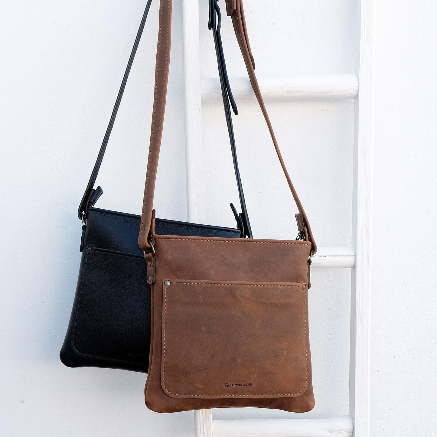 Cross over black and brown leather satchels