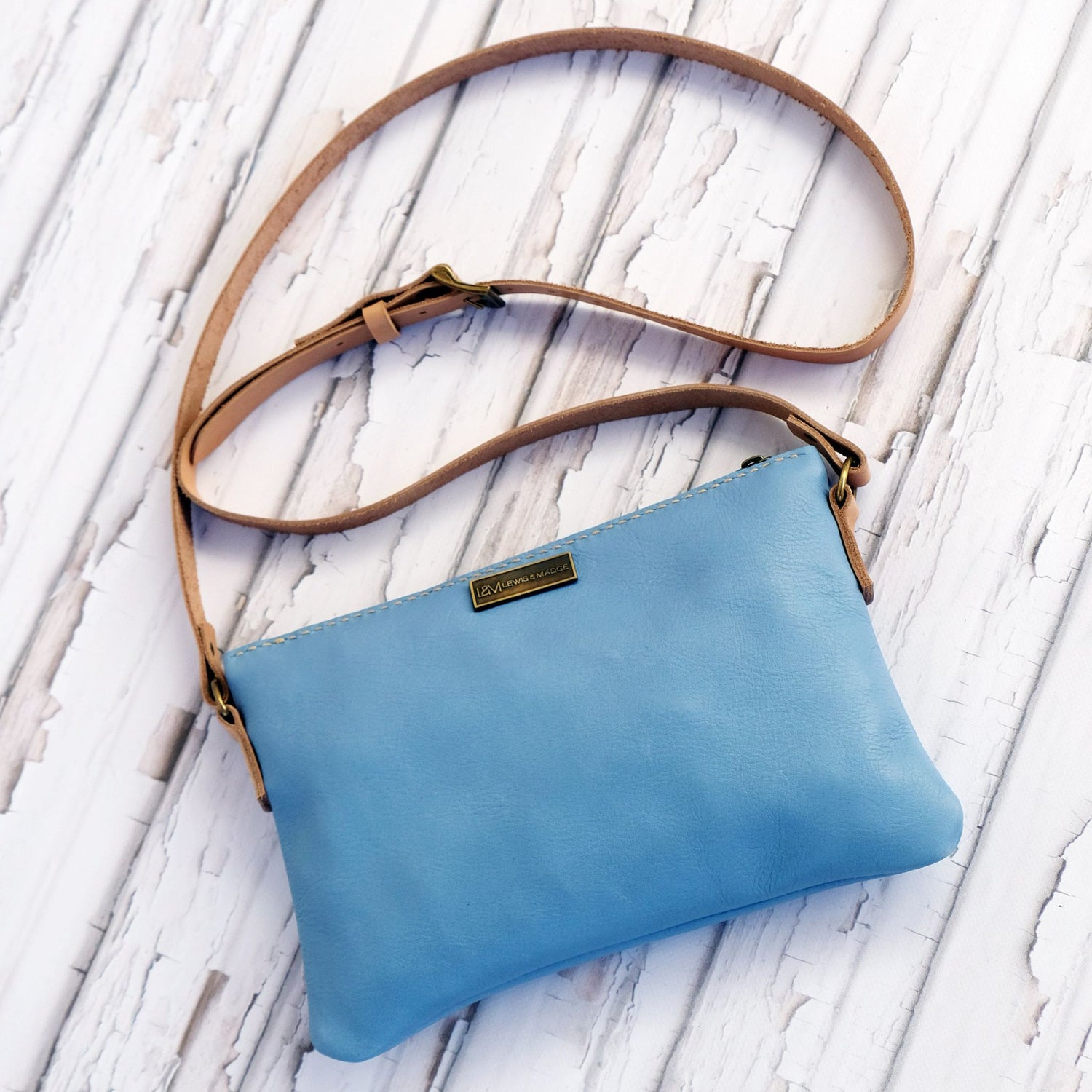 Light blue leather casual sling bag.