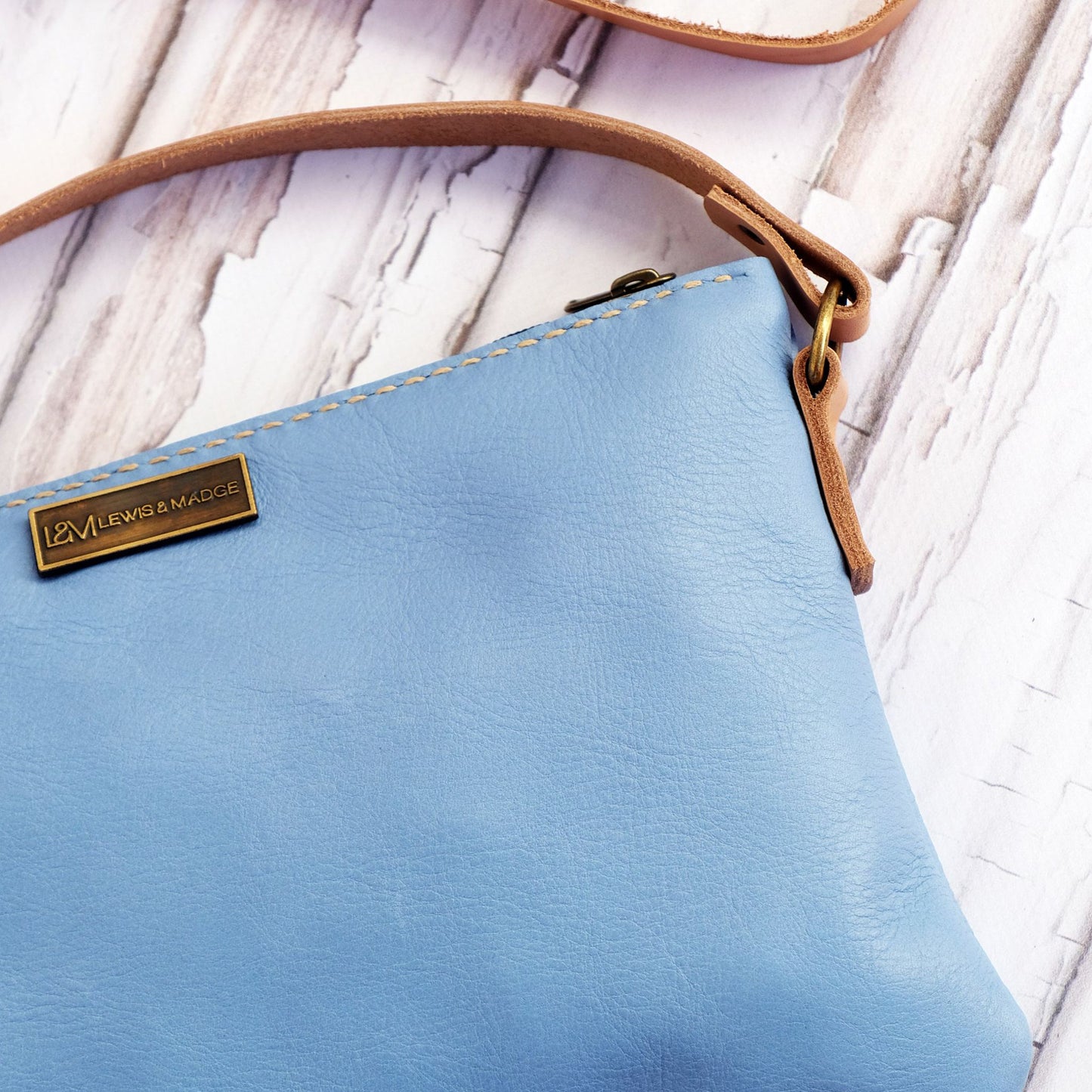 Light blue leather casual sling bag.