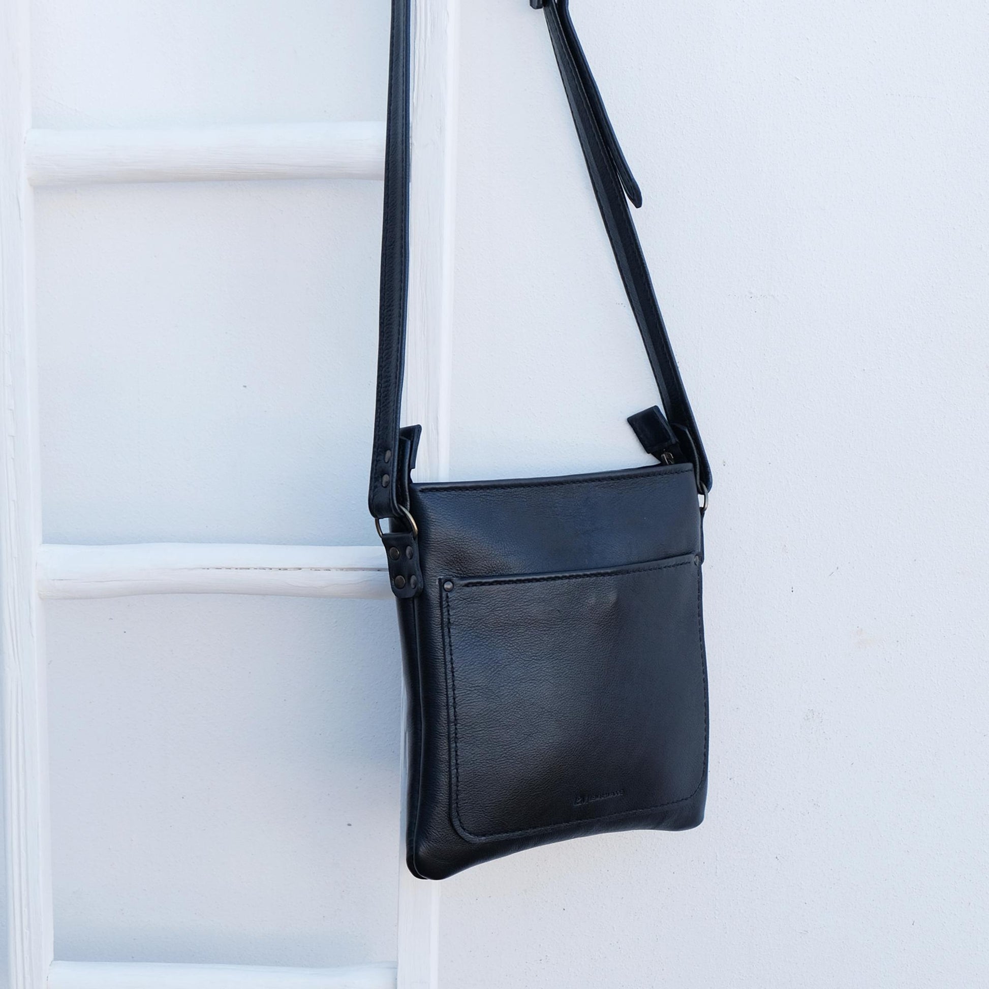 Cross over black leather satchel