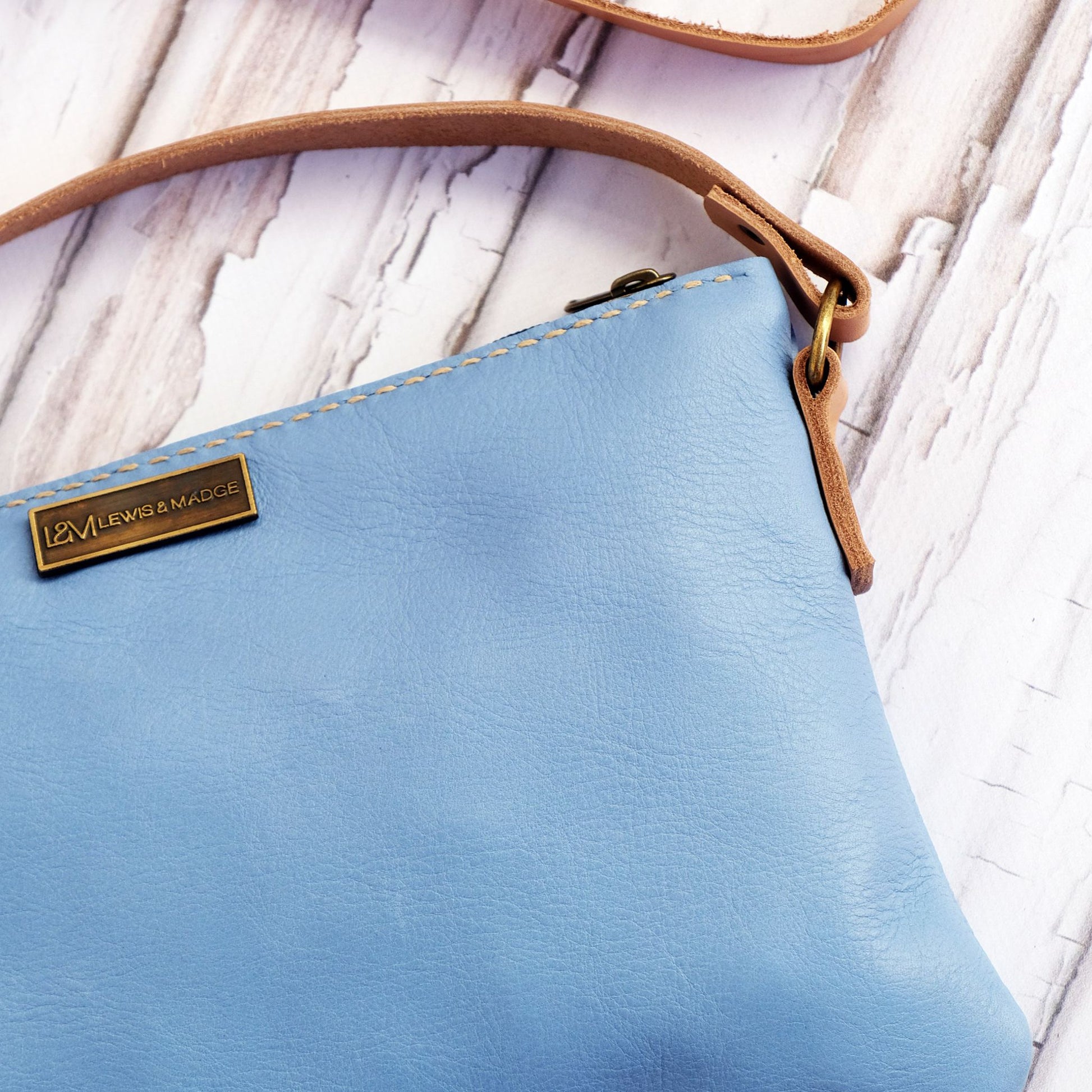 Light blue leather casual sling bag.