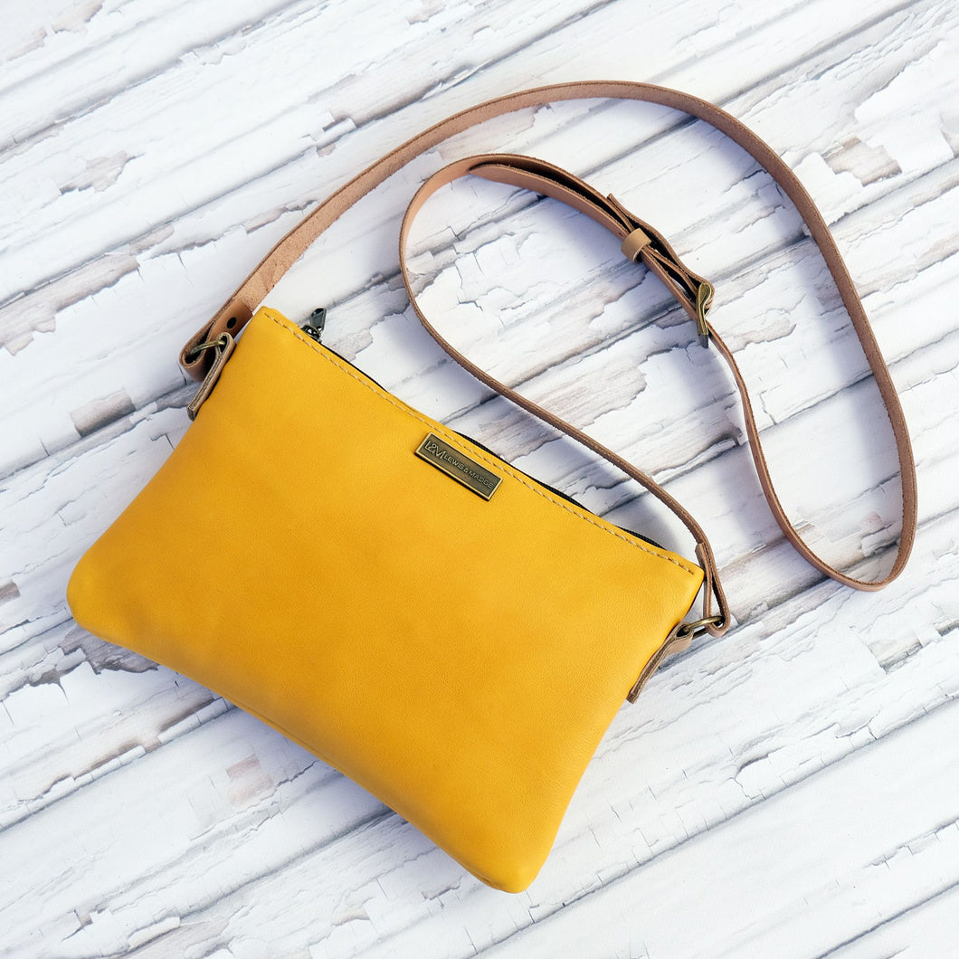 Mustard leather casual sling bag.